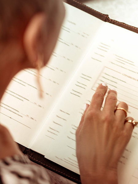 Person studying a menu