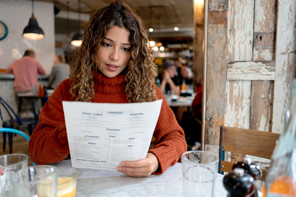 Woman looking at menu